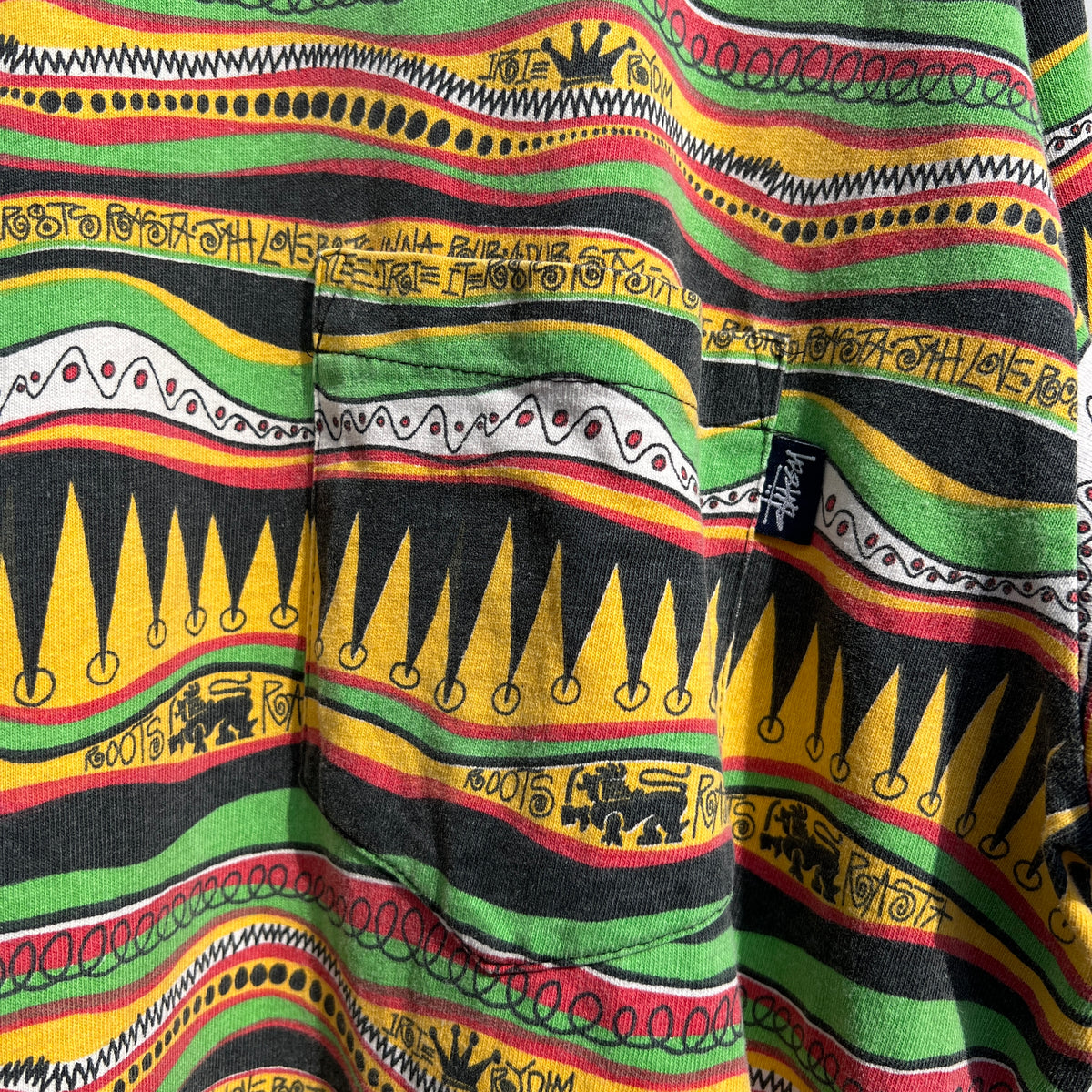 1980s Stüssy "TomTom" Irie Roots and Rasta Rydim Pocket T-Shirt with All-over Print