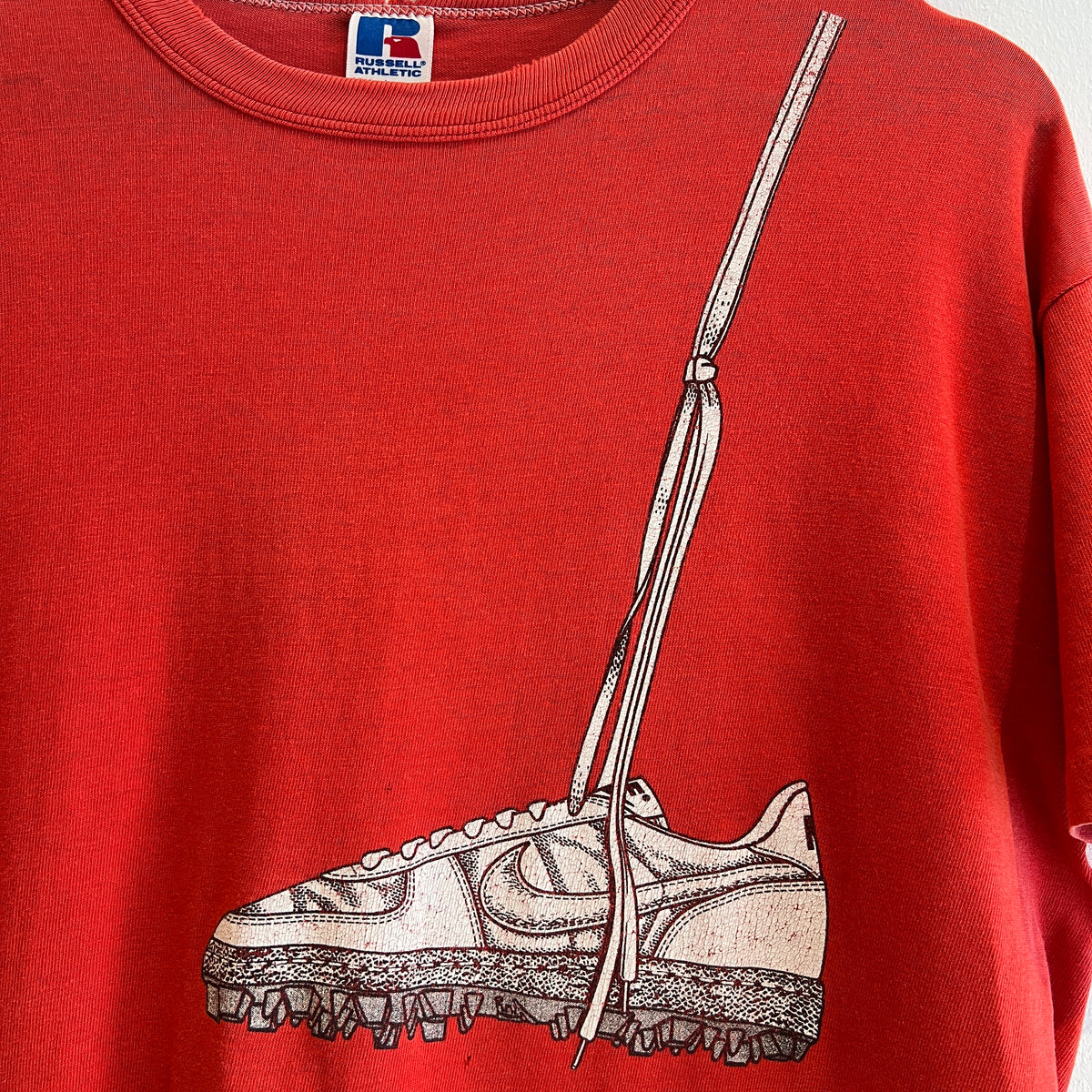1980s Russell Athletic Faded Red T-Shirt with Nike Sneaker and Logo Print