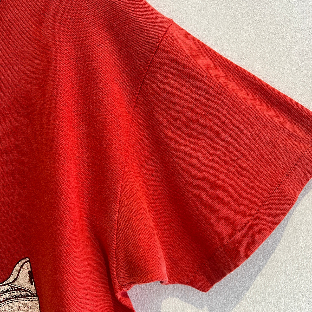 1980s Russell Athletic Faded Red T-Shirt with Nike Sneaker and Logo Print