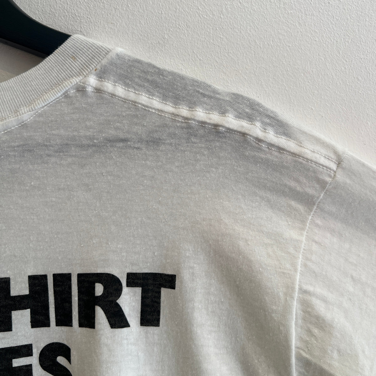 1985s Live Aid Logo T-Shirt with This Shirt Saves Lives Letters Print