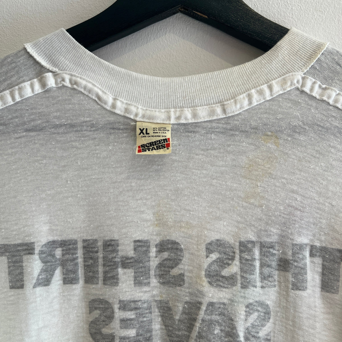 1985s Live Aid Logo T-Shirt with This Shirt Saves Lives Letters Print