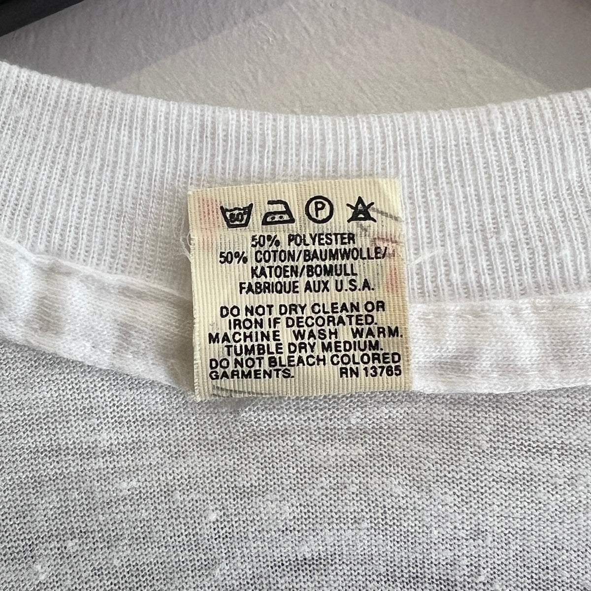 1985s Live Aid Logo T-Shirt with This Shirt Saves Lives Letters Print