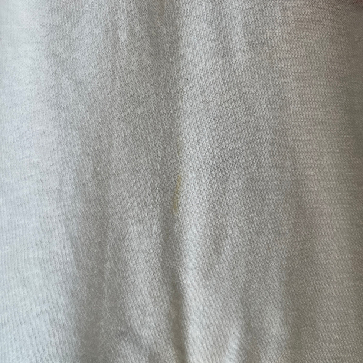1985s Live Aid Logo T-Shirt with This Shirt Saves Lives Letters Print