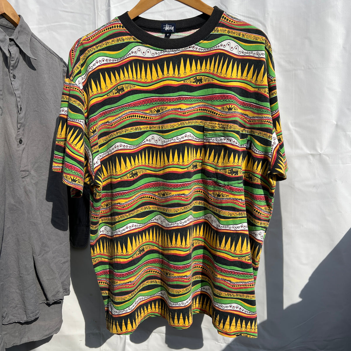 1980s Stüssy "TomTom" Irie Roots and Rasta Rydim Pocket T-Shirt with All-over Print