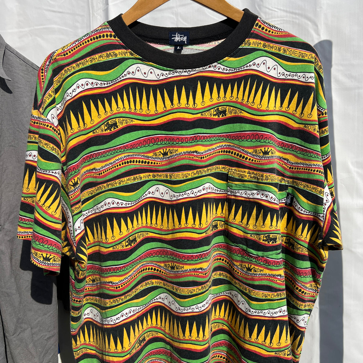 1980s Stüssy "TomTom" Irie Roots and Rasta Rydim Pocket T-Shirt with All-over Print