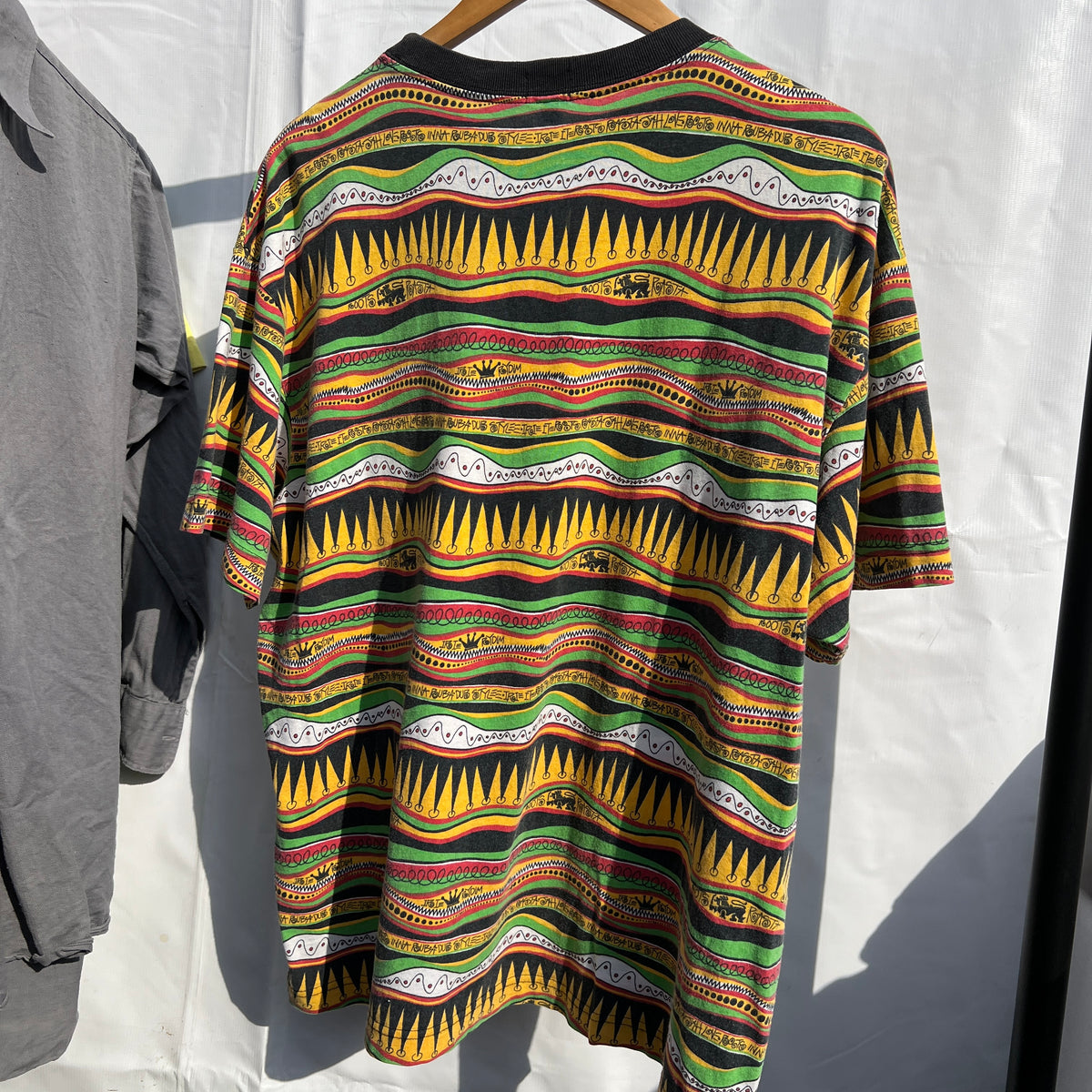 1980s Stüssy "TomTom" Irie Roots and Rasta Rydim Pocket T-Shirt with All-over Print