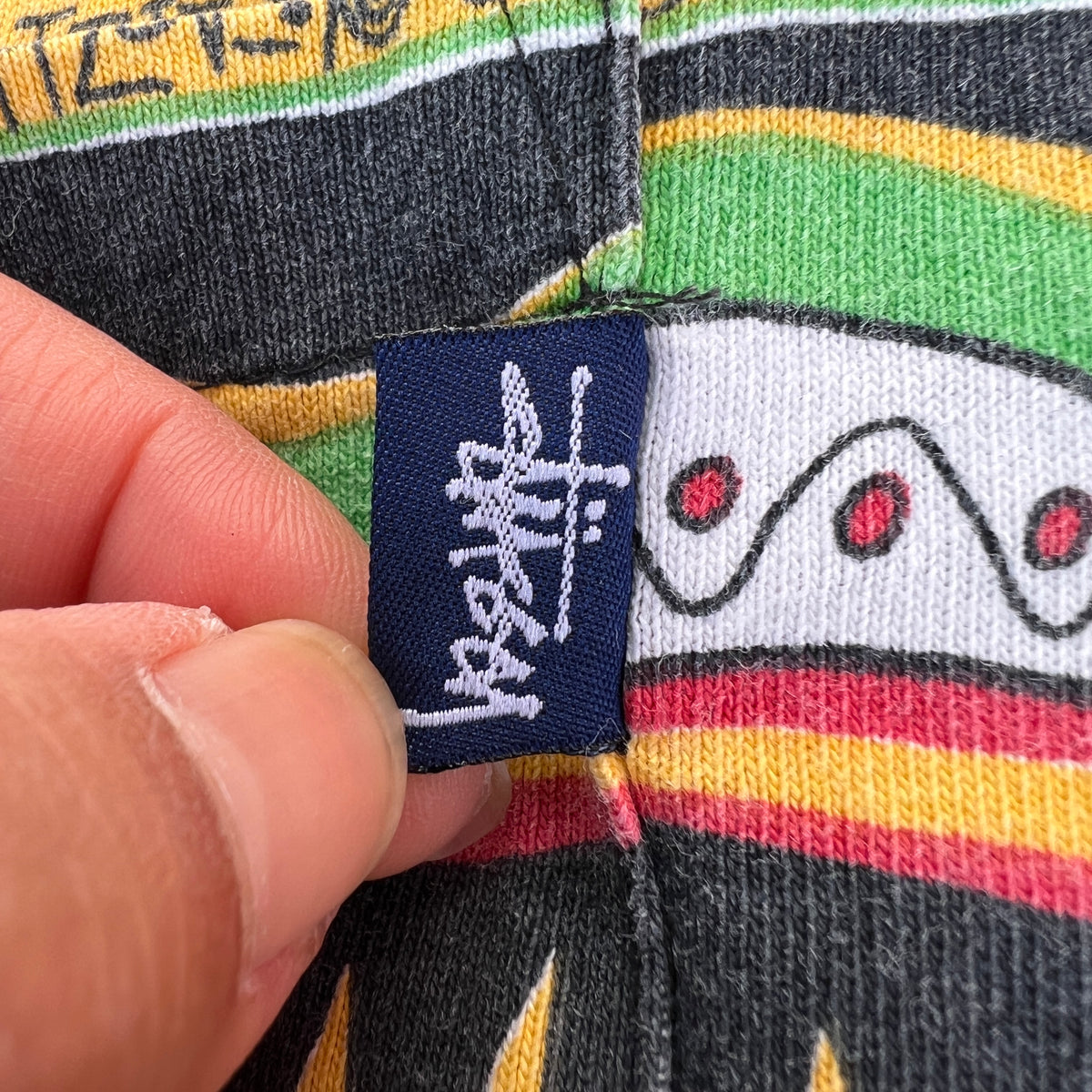 1980s Stüssy "TomTom" Irie Roots and Rasta Rydim Pocket T-Shirt with All-over Print